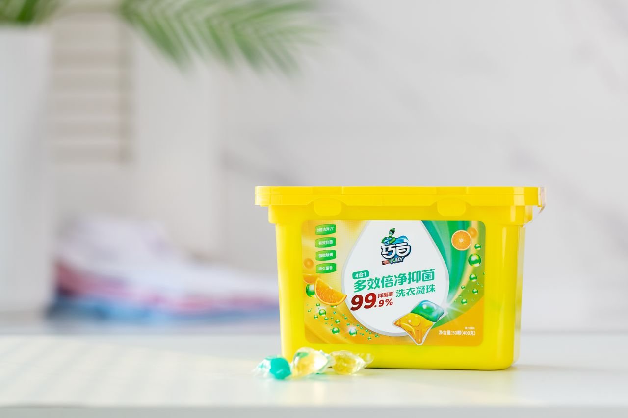 The Art of Drawing Readers In: Your attractive post title goes here Close-up of a yellow laundry detergent container with colorful design on table.